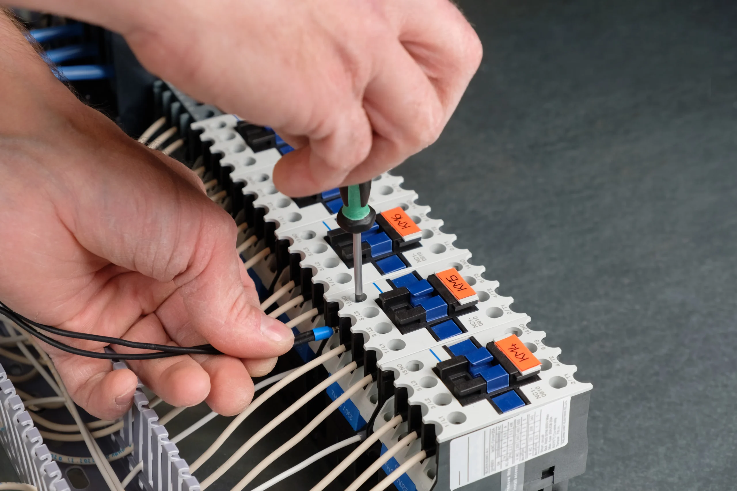 technician-onnecting-the-wire-to-the-relay-assem-2024-10-13-07-34-37-utc_11zon